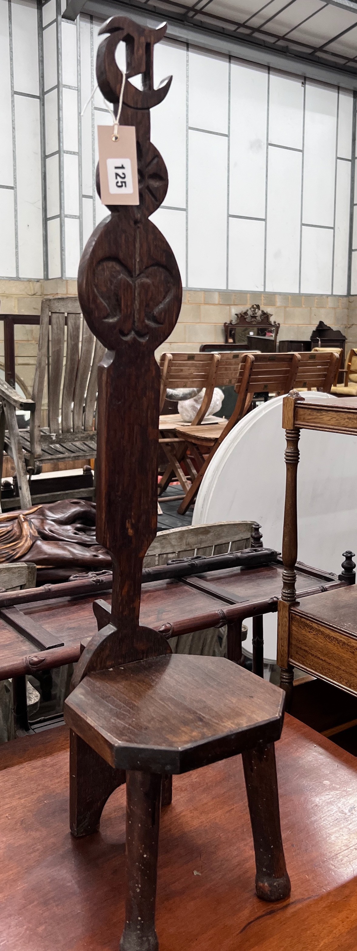 A carved oak spinning chair, height 82cm *Please note the sale commences at 9am.